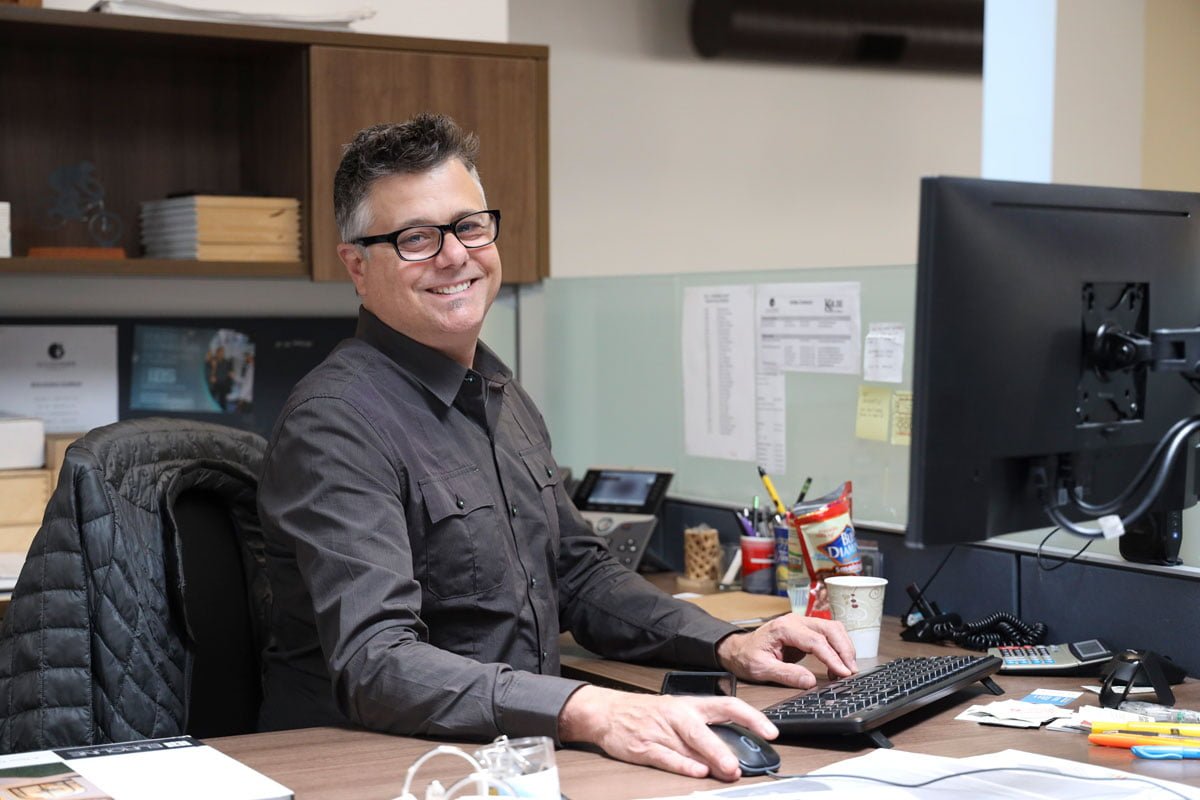 GSL Concord staff smiling while working at their desk