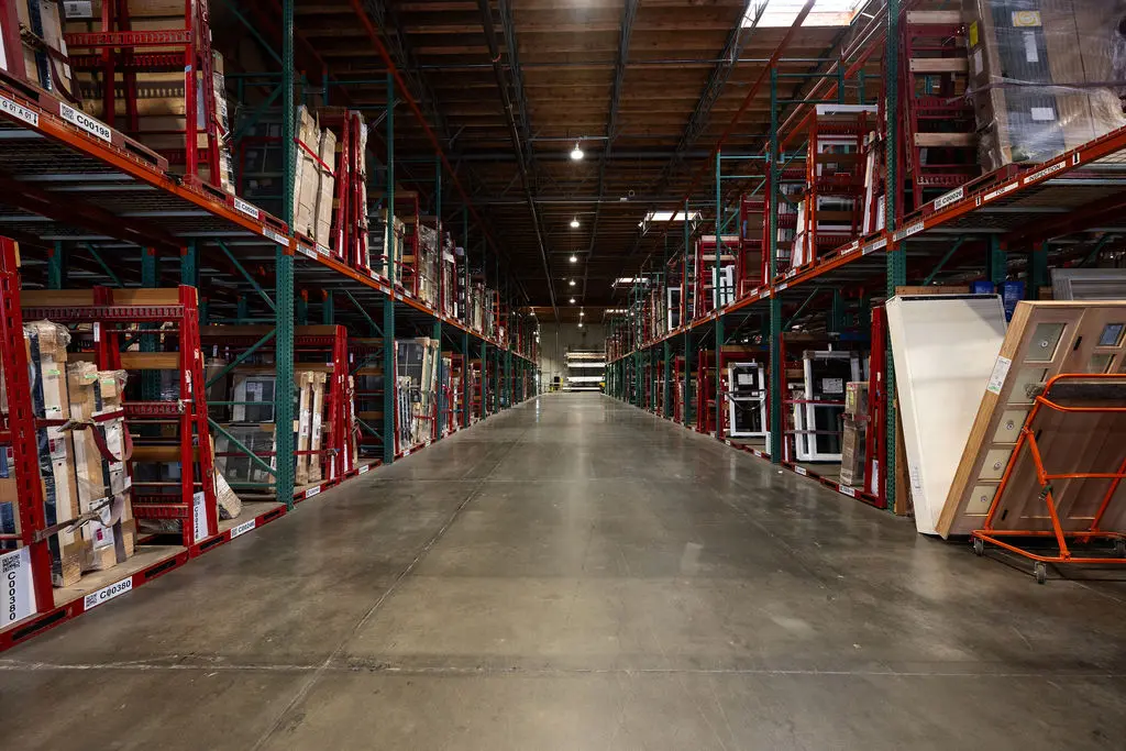 Long aisle view in the Golden State Richmond custom door shop