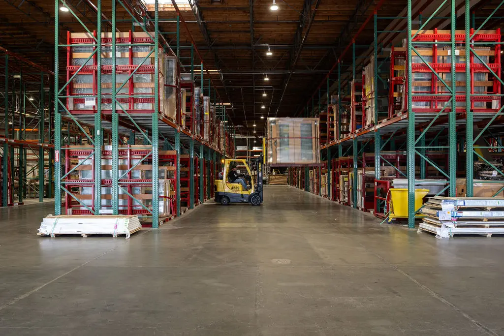 A forklift driver rearranges stock at Golden State Richmond