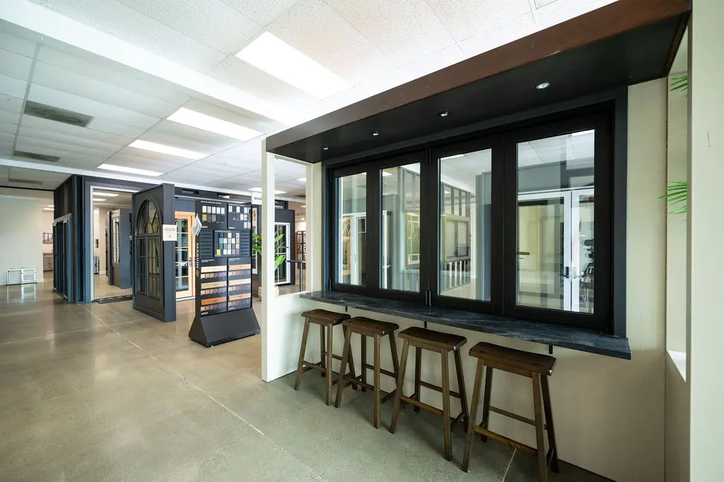 Display of exterior window with counter and stools at Golden State Lumber Sacramento Showroom