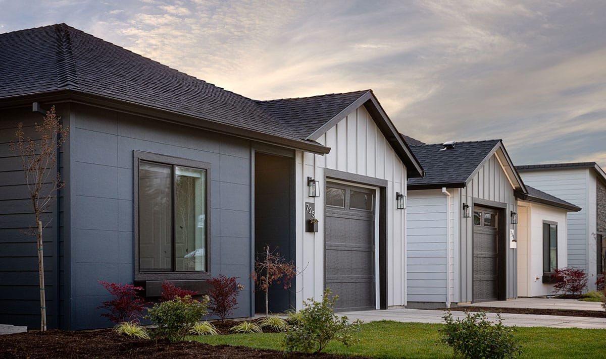 Angled view of James Hardie exterior siding on three residential homes