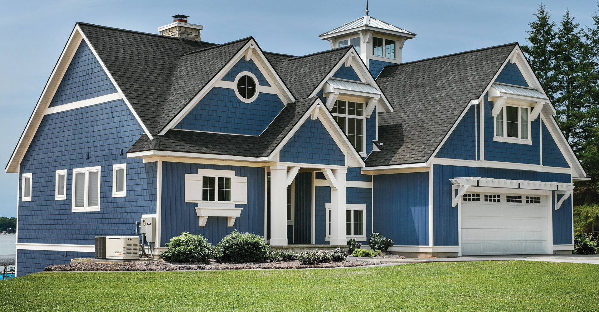 AZEK Exteriors shingles on large two-story lakeside home