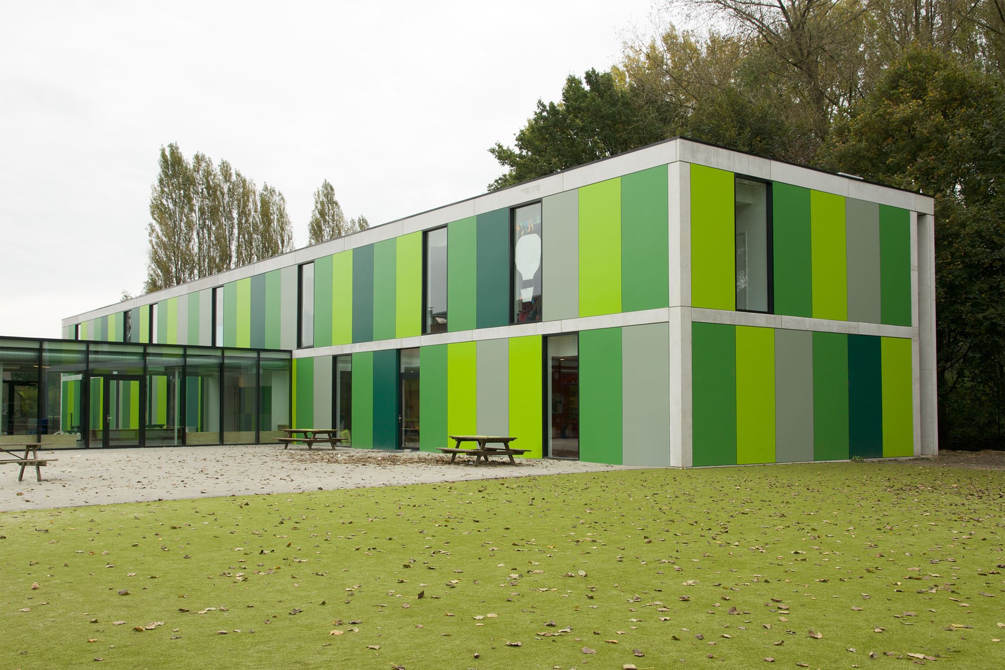 green patterned building trespa