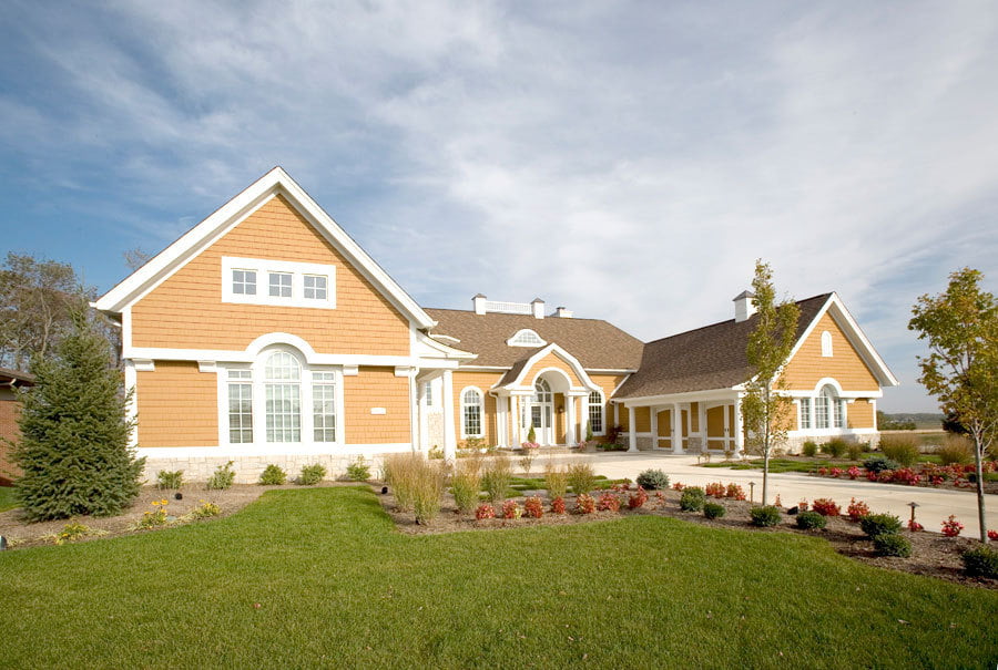 beige home with shakertown siding
