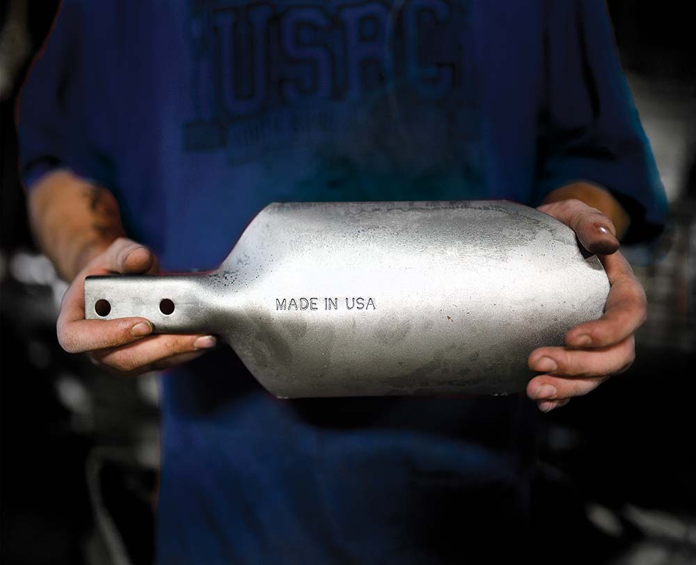 Closeup of person holding a Seymour Midwest shovel head
