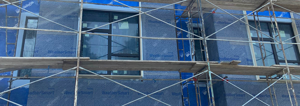 Henry WeatherSmart barrier behind scaffolding