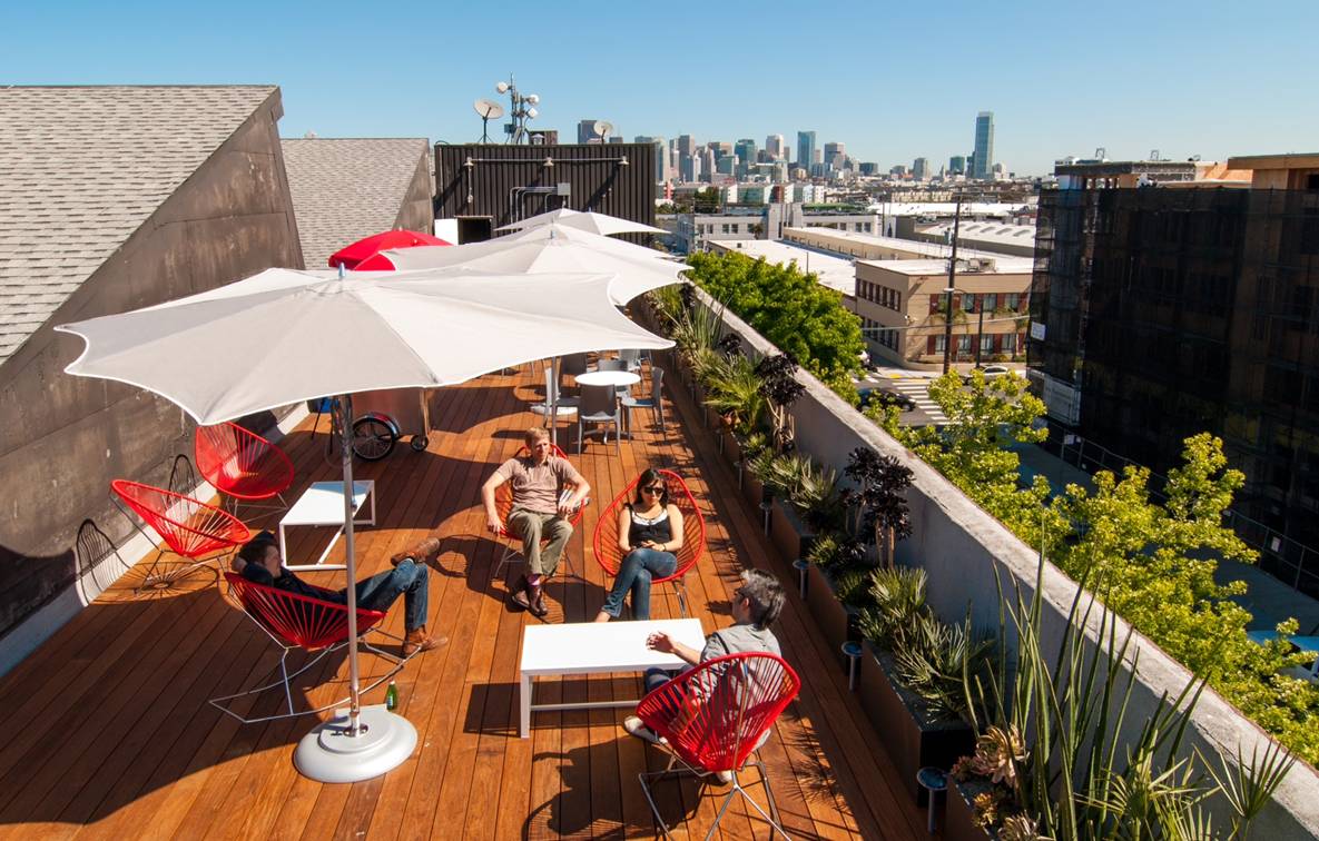 Pau Lope Company rooftop deck with city view