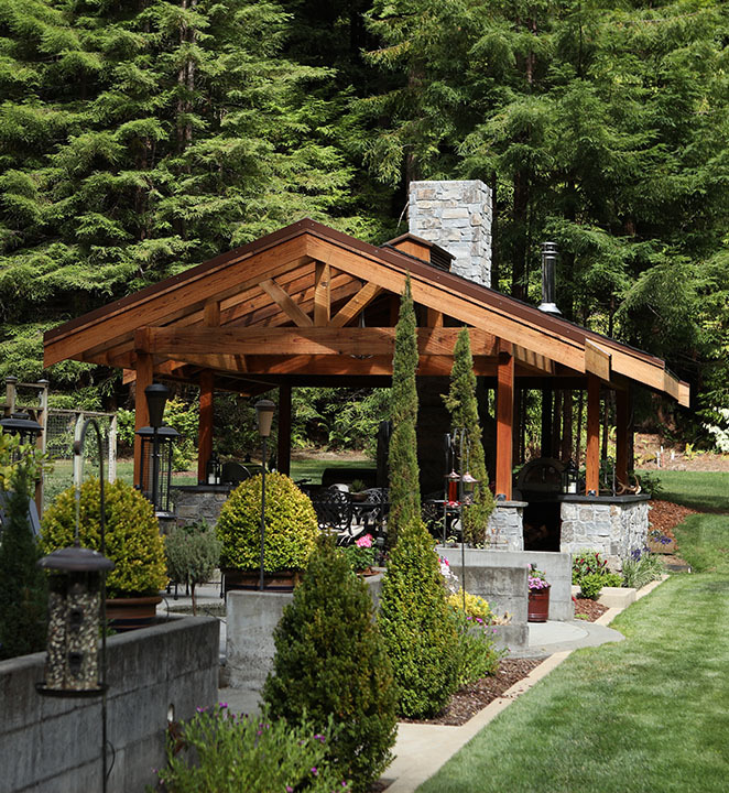 Humboldt Sawmill backyard pergola in forested home