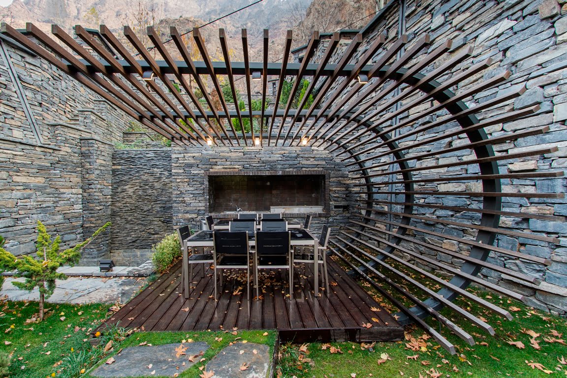 Moso Bamboo used in stone patio with deck and curved pergola