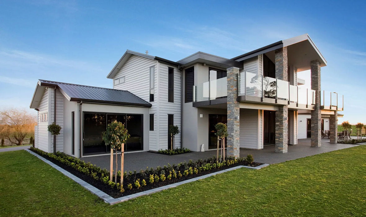 Large farmhouse-style home with beams and boards from Doman Building Materials
