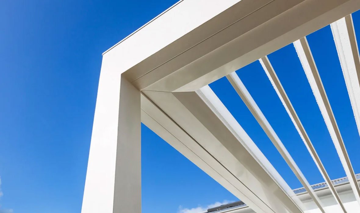 Closeup from underneath a white pergola