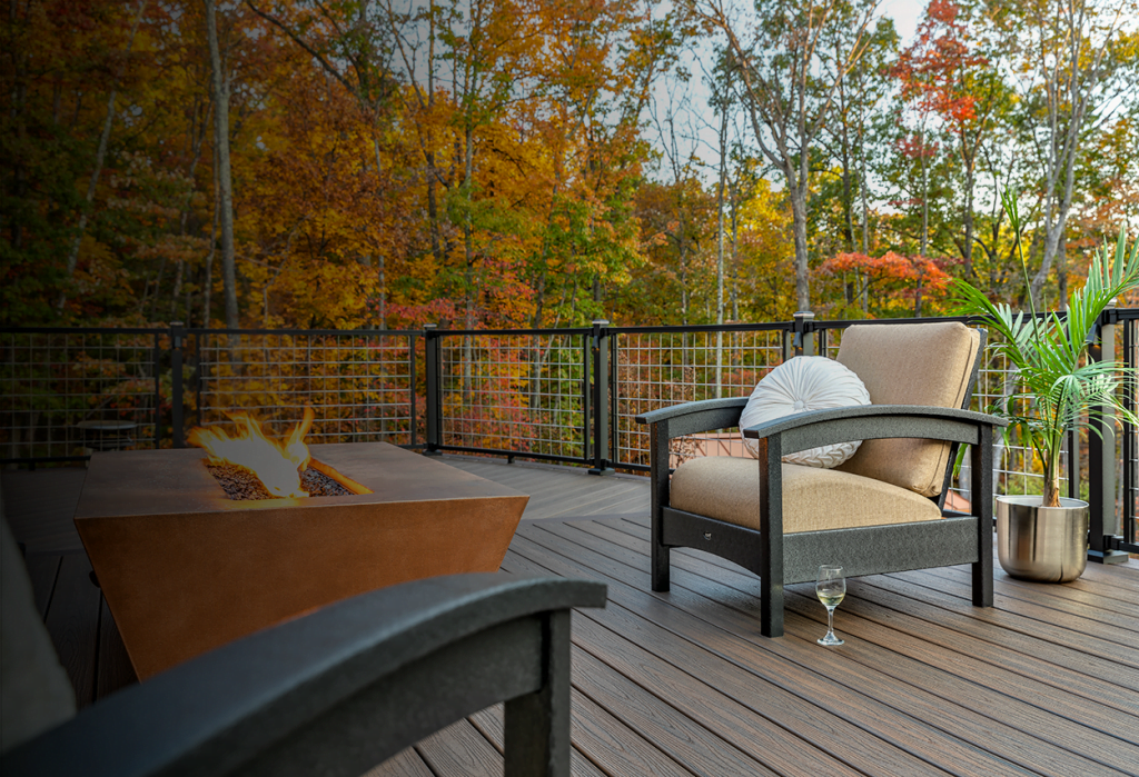Deck with fireplace and fall foliage