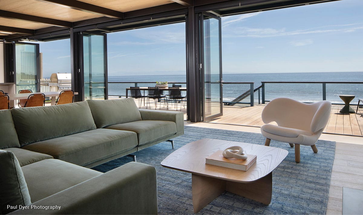Fleetwood Windows and Doors Bifold Doors opening to an oceanview deck