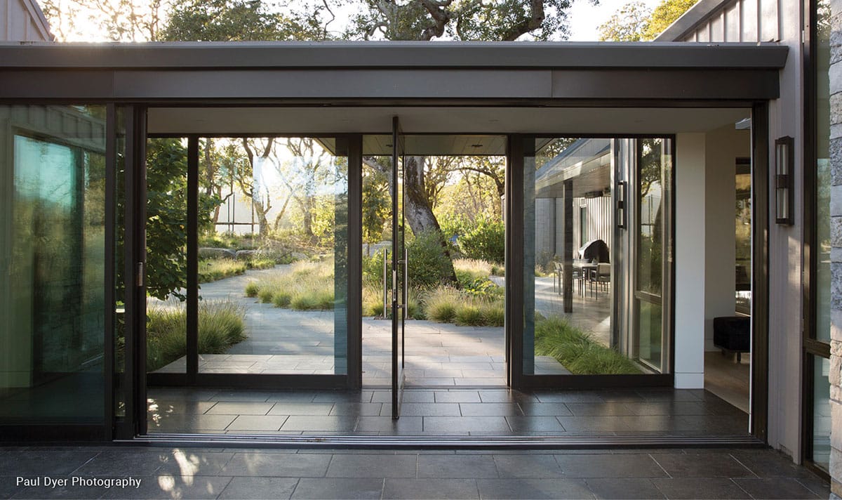 Fleetwood windows and revolving doors on the entrance of a home