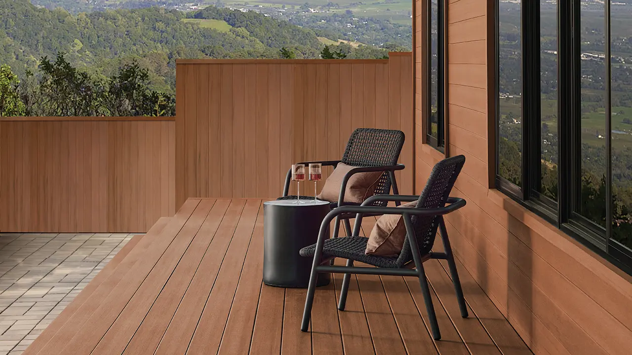 Side view of a patio deck using AZEK Exteriors vintage cladding in mahogany