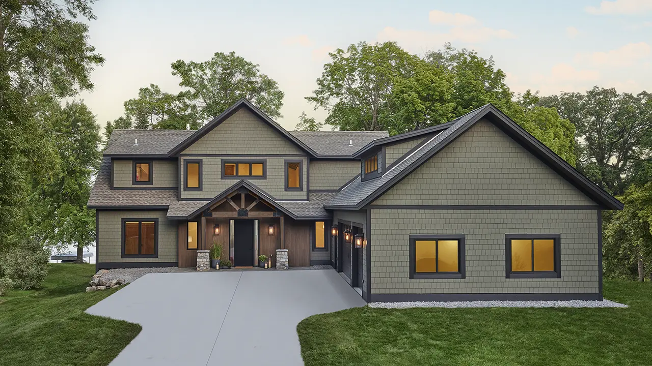Entrance of large country home featuring AZEK Exteriors shingle siding in English Walnut