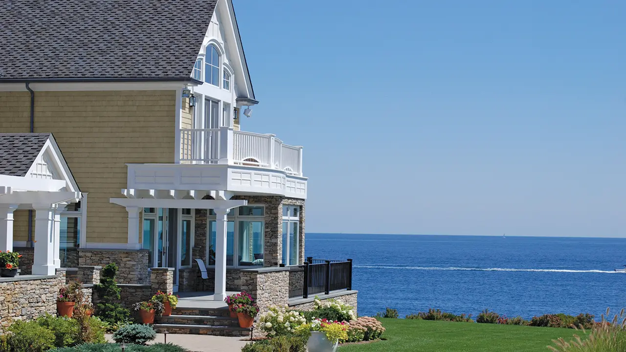 Ocean view home with AZEK Exteriors trim moulding on second story bedroom deck