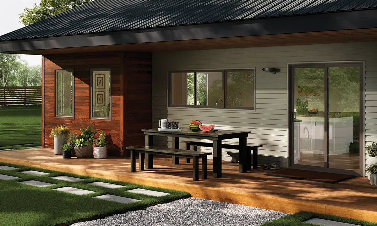 Backyard view of a home with Milgard Trinsic Exterior Vinyl windows and doors in black