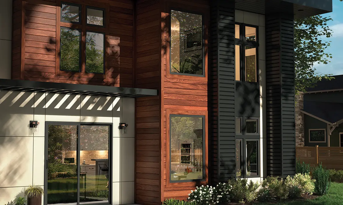 Two story home with wood and stone cladding, and Milgard Trinsic Exterior Vinyl windows and doors in black