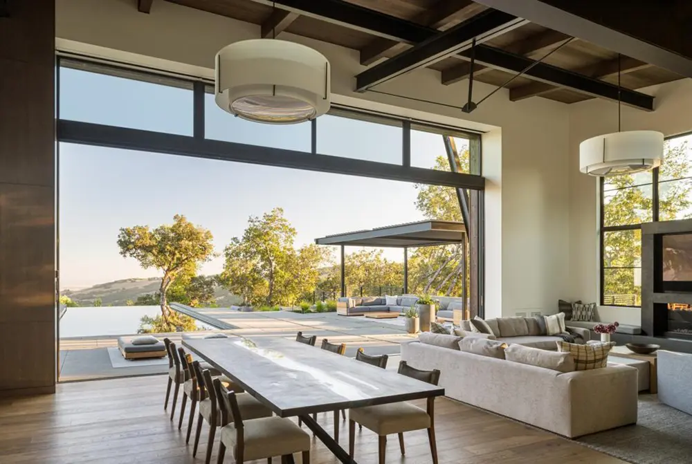 View of a large Western Architectural Openings window wall from inside a Sonoma Mountain home dining room