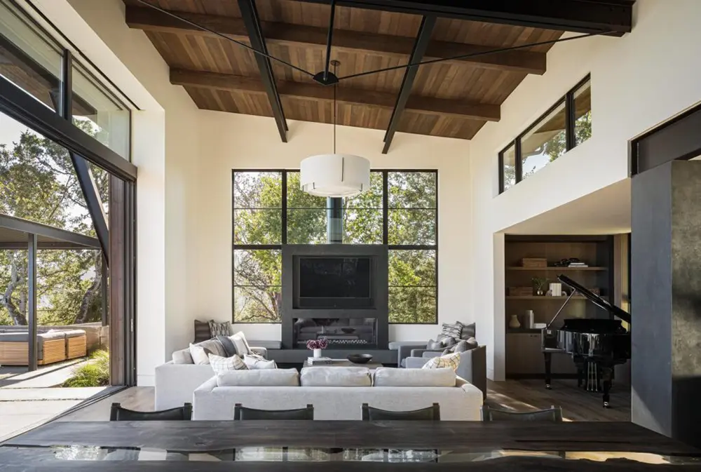 Bright living room with fireplace inside a Sonoma Mountain home with Western Architectural Openings windows