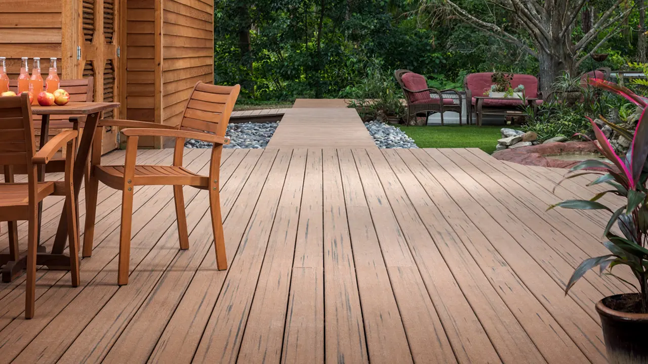 Landscaped backyard deck with MoistureShield composite decking