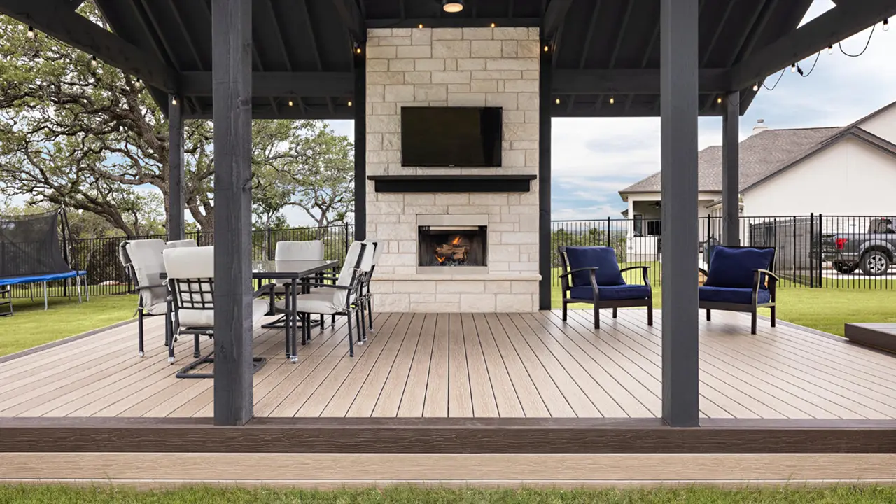 Pergola deck with MoistureShield decking and stone fireplace
