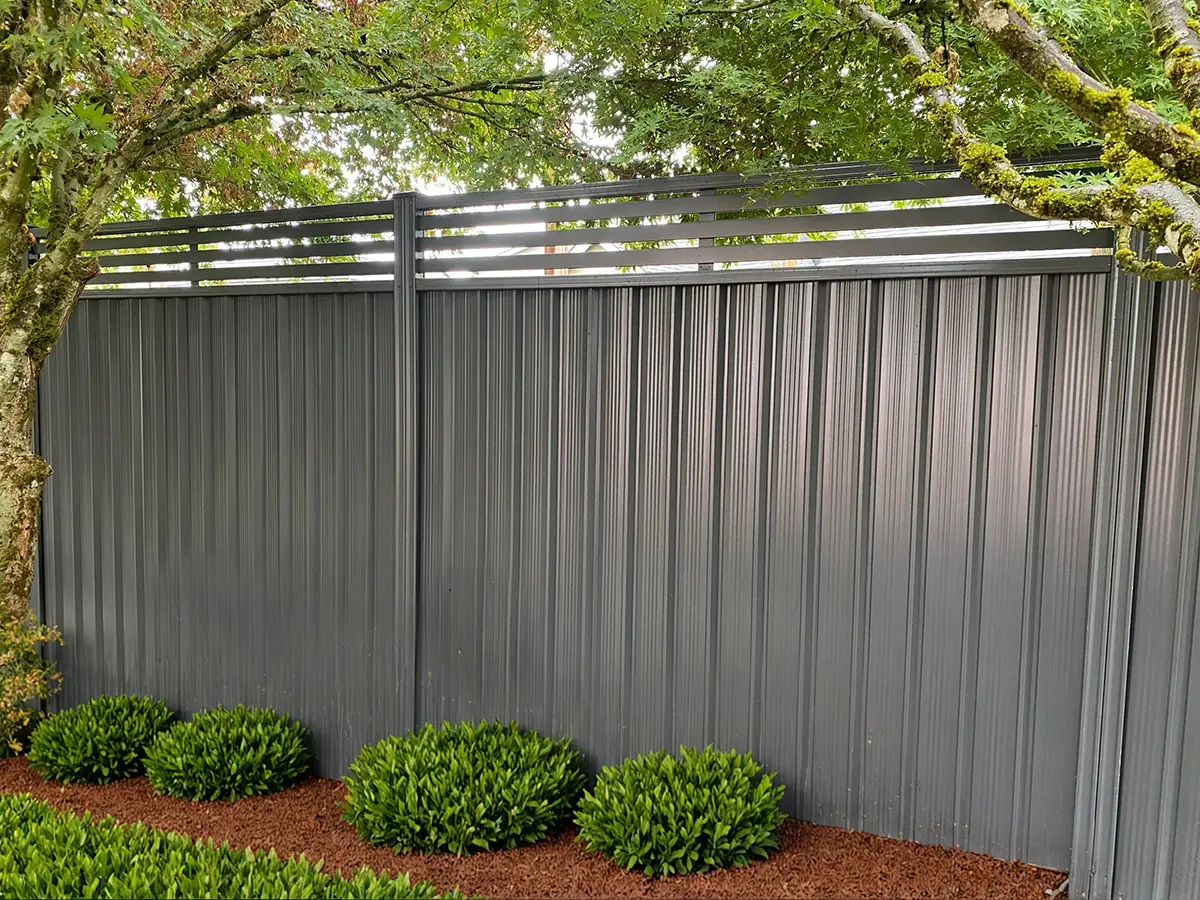 ColorMAX Colorbond fence in Woodland Grey color with top slats
