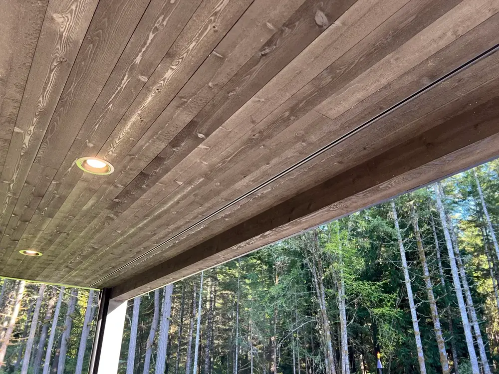 Back deck view of a Joto-Vent System Continuous Soffit Vent on a cabin home