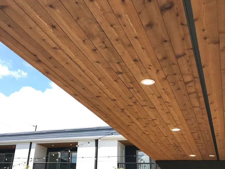 Underside of a Joto-Vent System Continuous Soffit Vent on a new home build with recessed lighting